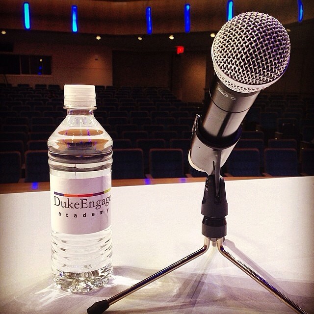 A DukeEngage water bottle and a microphone