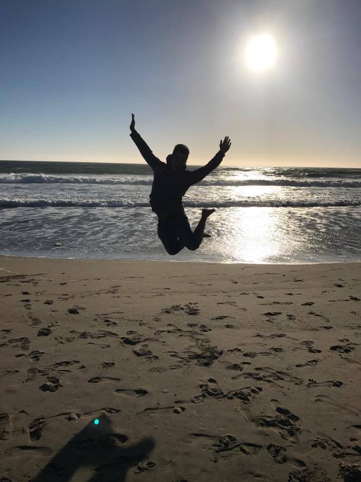 A person jumping at the beach