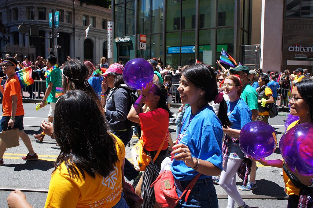 People marching in a Pride parade