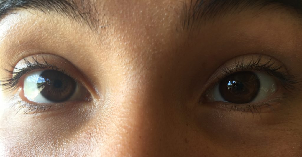 close-up photo of a young woman's eyes