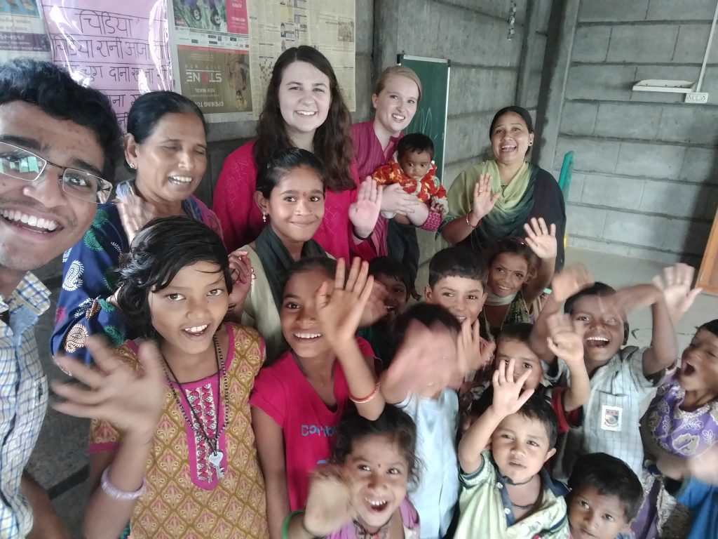 people waving at the camera