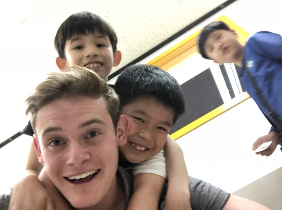 blurry photo of kids on top of student
