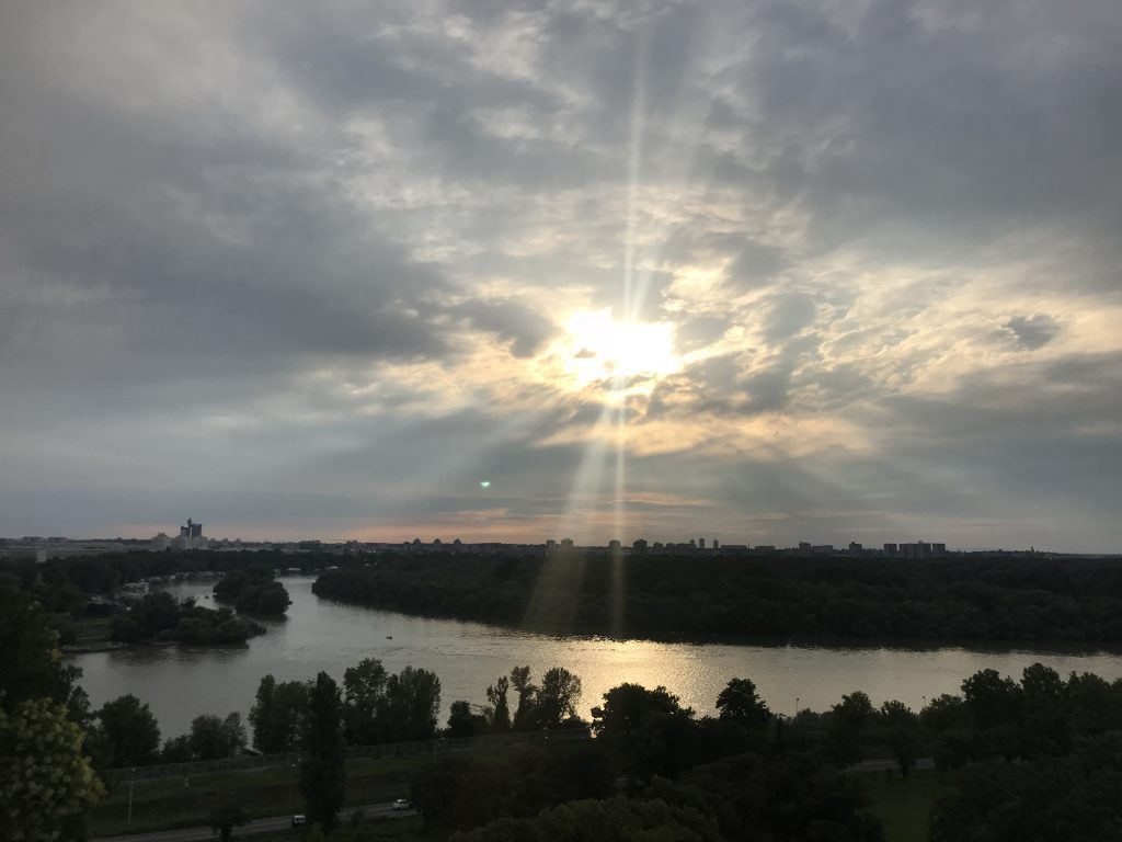 view of sun breaking through clouds