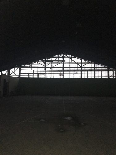 a darkly lit, large exercise space