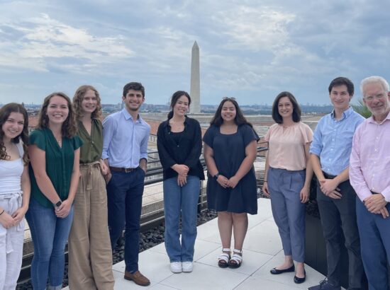 DukeEngage in DC team posing in a group photo with the Washington Monument in the background