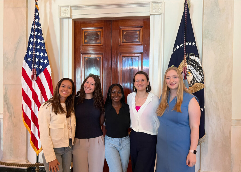 A group of young woman posing inside the White House