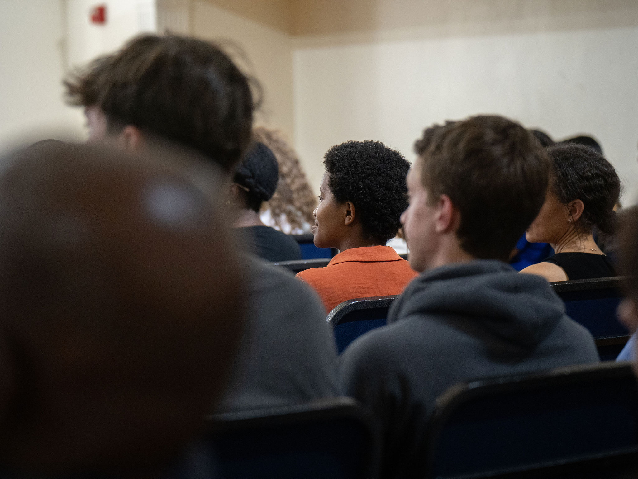 An audience listening intently