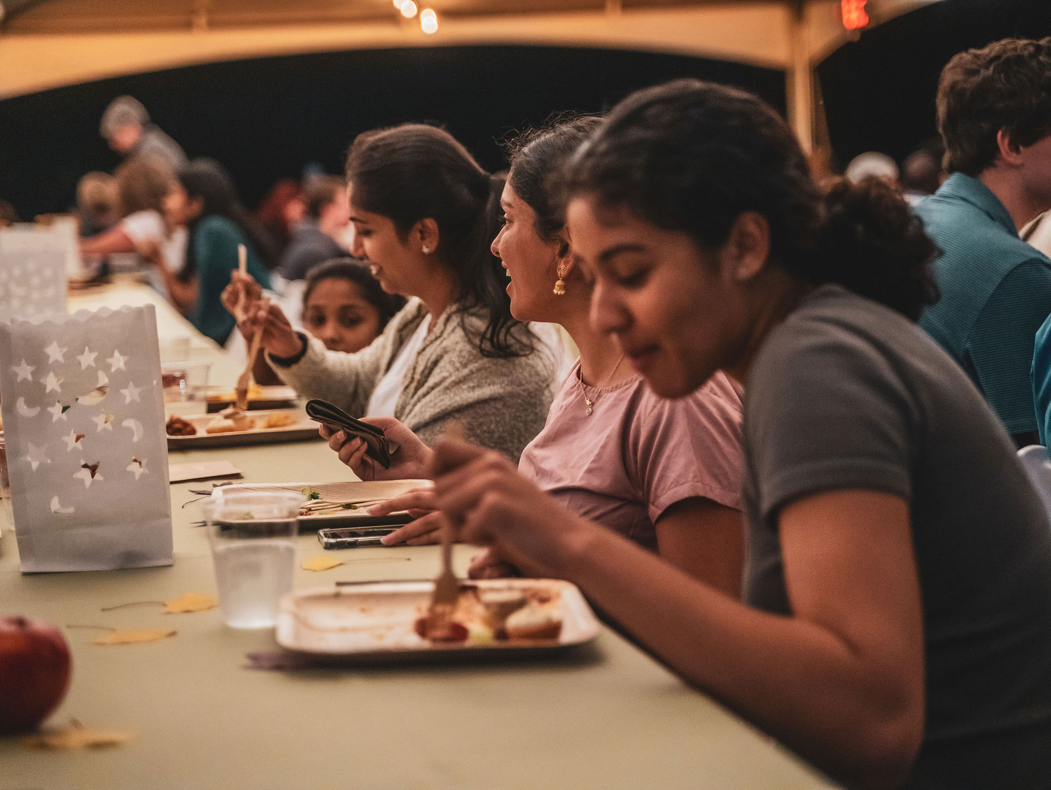 Seated students eat