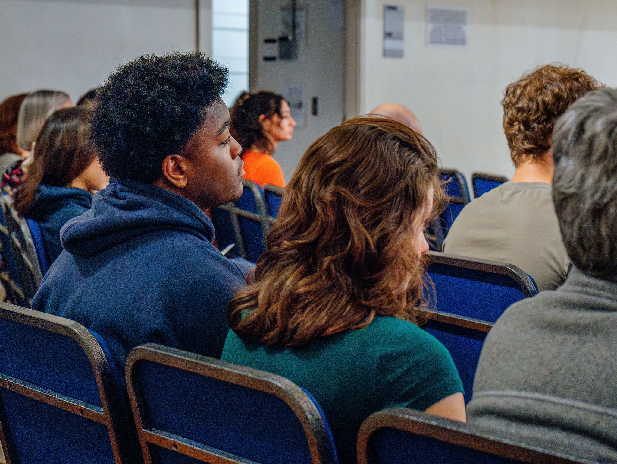 An audience listening intently